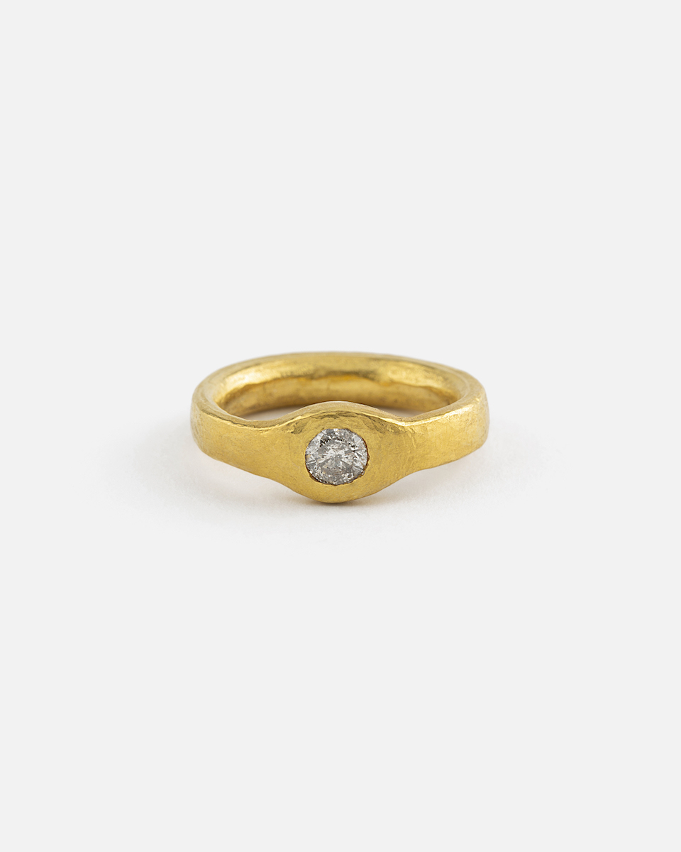 fine gold ring with salt and pepper diamond